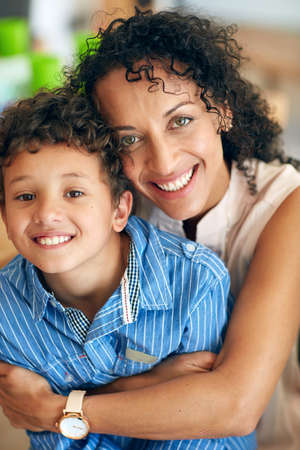 Ill never let you go. Portrait of a happy mother posing with her adorable little boy at home.