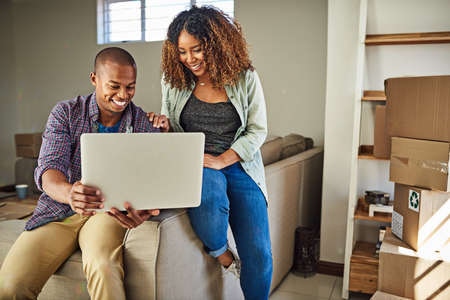 What do you think of this color for the walls. Shot of a cheerful young couple doing online shopping...