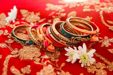 The best jewellery to get you looking your best. Shot of beautiful bangles for a bride to wear at a traditional wedding.の写真素材