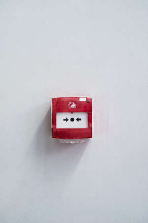 Press in case of an emergency. Shot of a fire alarm on a wall.