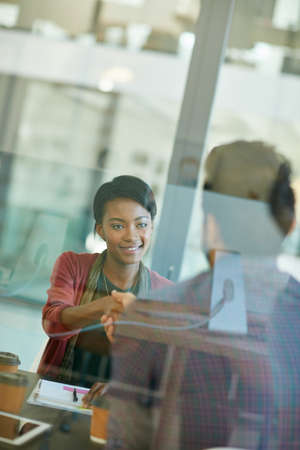 Thank you for joining us. Shot of a team of creative businesspeople having a meeting in their...