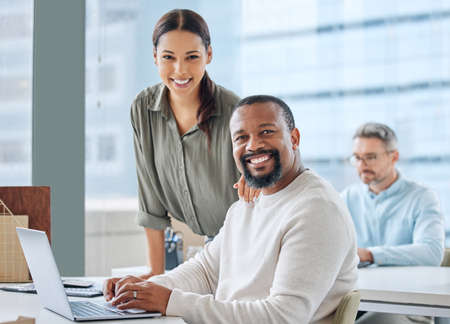 Were making great progress in our plans. Portrait of two businesspeople working together on a laptop...