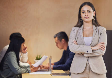 Ive got great confidence in my team. Cropped portrait of an attractive young businesswoman standing...