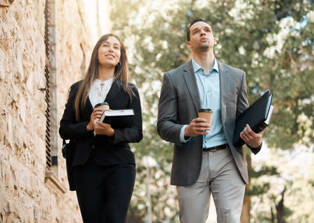 Every step brings you closer to justice. Shot of two business colleagues walking together in the city.の写真素材
