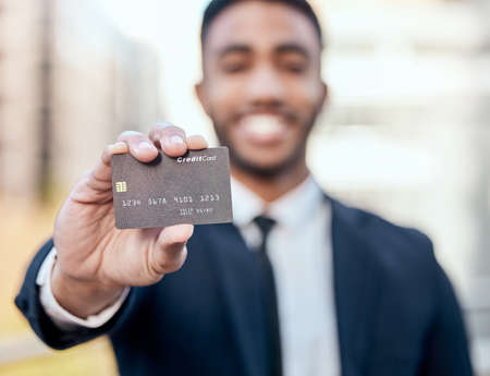 Invest in the right businesses. Shot of an unrecognizable businessman standing alone outside and...