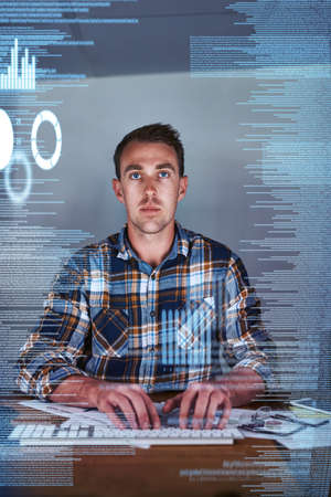 No glitches get past him. Shot of a young programmer working at his computer with an overlay of...