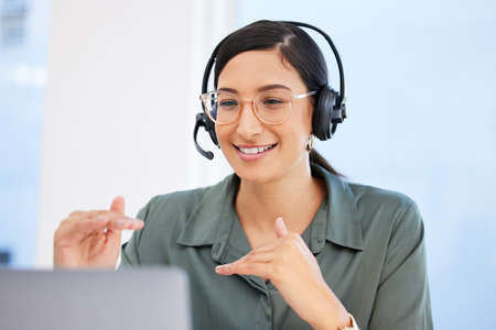 Yes this is how our process works. Shot of a businesswoman working in a call center.の写真素材