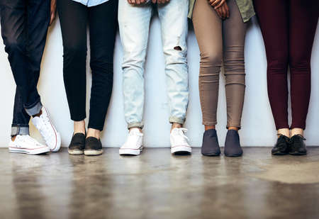 The wall to be. Cropped shot of unrecognizable university students in a campus corridor.の写真素材