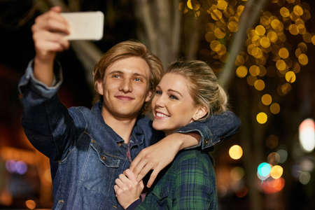 This is a night to remember. Shot of a young couple taking a selfie while out on a date.