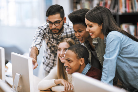 Putting in the work to pass. Cropped shot of university students checking out social media platforms...