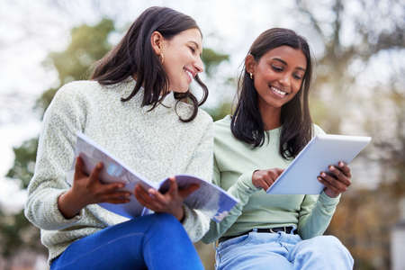 Theres nobody like a study buddy. Shot of two young women studying together at college.