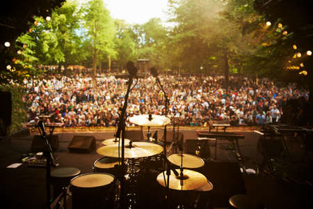 Cropped shot of a musicians feet on stage at an outdoor music festival.の写真素材