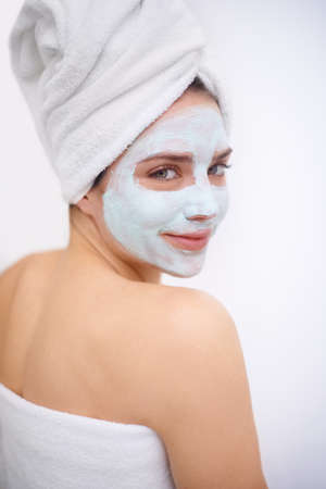 Getting rid of all impurities. A young woman wearing a facemask.の写真素材