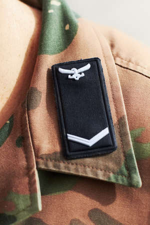 Closeup shot of a battalion insignia on a shoulders lapel.の写真素材