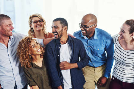 They share many fun moments together. Shot of a group of people standing together.