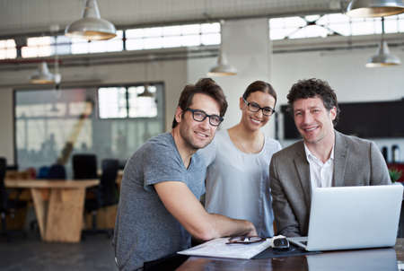 Well get the job done. Portrait of three business colleagues in the office.の写真素材