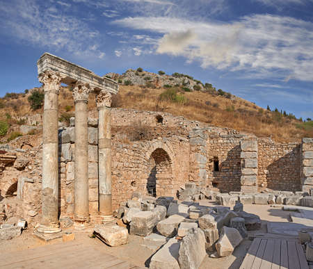 Ancient city ruins and pillars of Ephesus in Turkey in the day. Traveling abroad, overseas for holiday, vacation, tourism. Excavated remains of historical stone building in Turkish history, cultureの写真素材