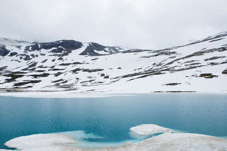 Majestic beautiful landscape glacial lake and ice snow mountain blue whiteの写真素材