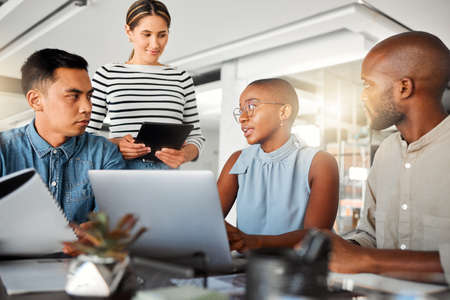 Group of diverse businesspeople having a meeting in an office at work. Business professionals...