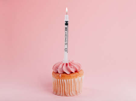 Youre only one cupcake away from diabetes. Closeup shot of a needle on a cupcake in the studio.