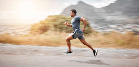 Boundaries are made to be pushed. Shot of a handsome young man running alone outdoors.