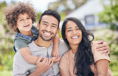 A loving family is the biggest blessing. Portrait of a happy family relaxing together outdoors.の写真素材