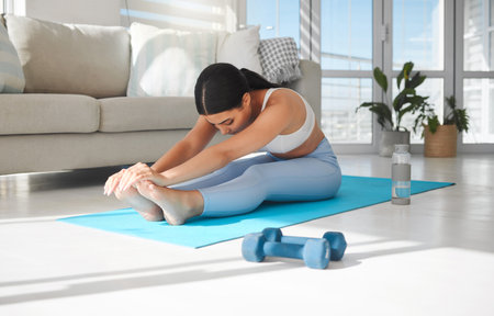 If you change nothing, nothing will change. Shot of a sporty young woman stretching while exercising...