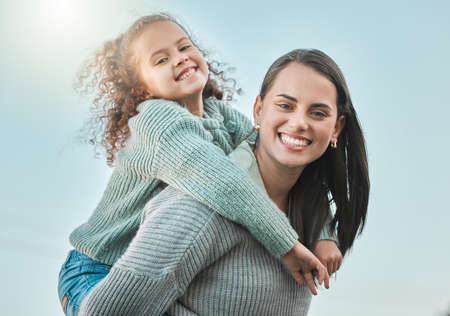 There is no more powerful love than one a parent. Shot of a little girl spending the day outdoors with her mother.の写真素材