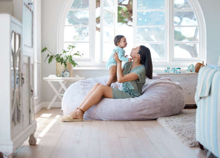 A day in the life of a mom. Shot of a mother bonding with her baby at home.