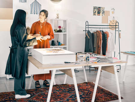 This is my vision. Shot of two young businesswomen talking at work.の写真素材