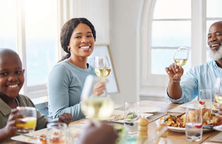 Dinner is better when we eat together. Shot of a family having lunch at home.