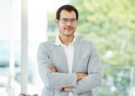 I always do business with confidence. Portrait of a confident young businessman standing with his...