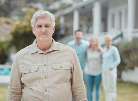 Shot of a mature man standing in the garden at home.