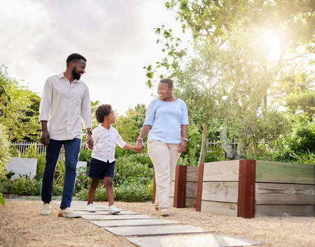 Were sure going to have a lovely day together. Shot of a happy family taking a walk together...