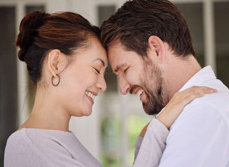 We can only learn to love by loving. Shot of a couple bonding on the porch at home.