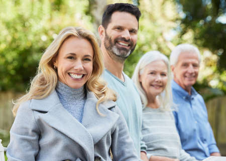 Family can help you can achieve. Shot of a couple spending time outdoors with their parents.の写真素材