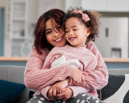 I love and adore her to bits. Portrait of a mother bonding with her little daughter at home.