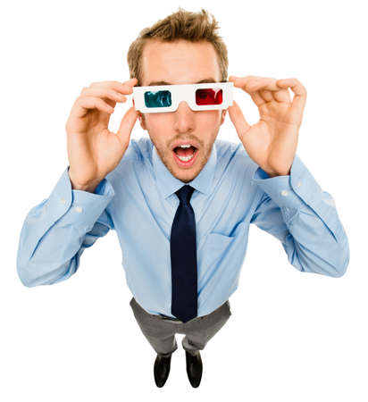 Take a look at the world around you. Shot of a young businessman wearing 3D glasses against a studio background.の写真素材