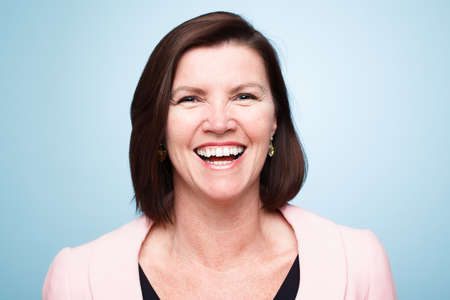 Spreading love and joy. Shot of a mature woman smiling against a studio background.