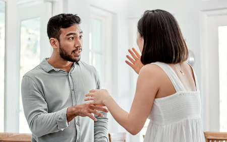 Compromise is a must. Shot of a young couple having an argument at home.