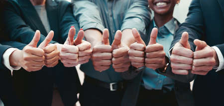 You have our full support. Cropped shot of a group of unrecognizable businesspeople showing a thumbs up.の写真素材