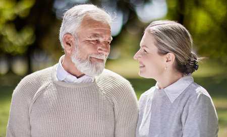 For that smile, I will do anything. Shot of a senior couple bonding outdoors together.の写真素材