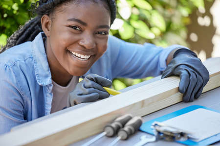 Successful people keep moving. Shot of a young woman working outside.の写真素材