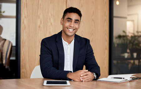 Id like to do business with you. Shot of a confident businessman sitting in his office.