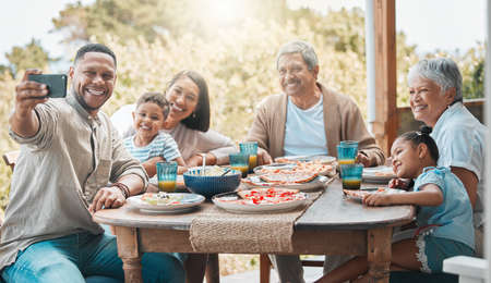 capture this shiny moment. Shot of a family having lunch together outside.