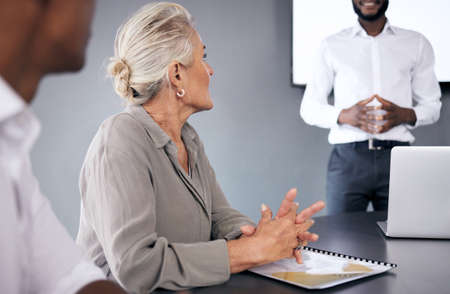 If you want to lift yourself, lift up someone else. Shot of a mature businesswoman sitting in on a...
