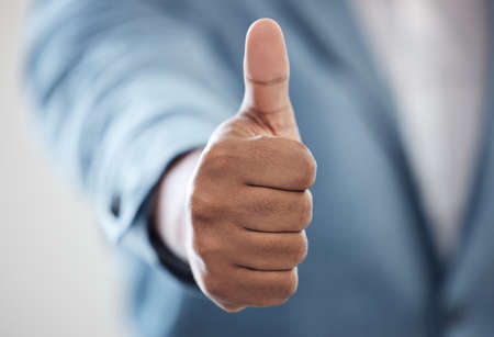Believe in what youre able to achieve. Closeup shot of an unrecognisable businessman showing thumbs...