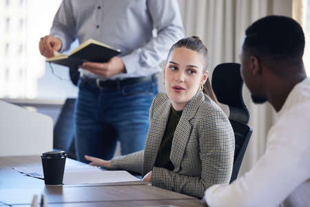 What do you think of that idea. Shot of two businesspeople in a meeting at work.