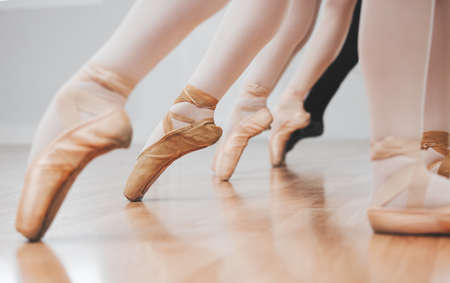 Ballet is incredible to watch. Shot of a group of ballerinas with toes pointed.の写真素材