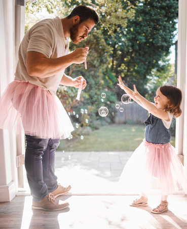 More dad. Shot of an adorable young girl and her father dancing together at home.